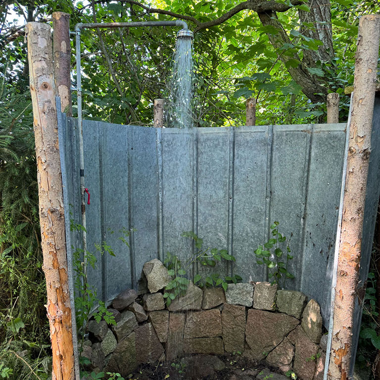 our shelter includes access to a cold-water shower, drinking water, and a composting toilet.